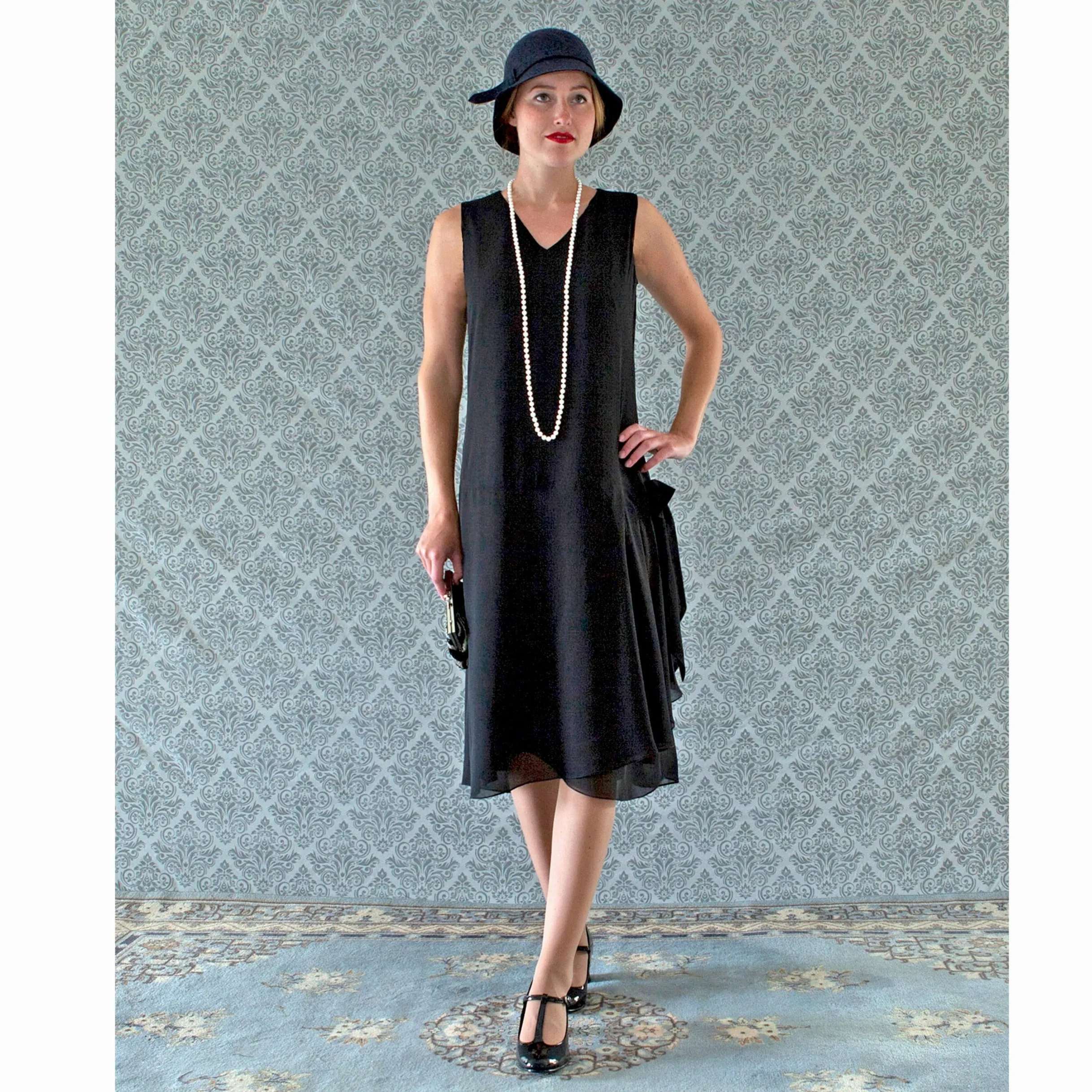 V-neck black flapper dress with drape and bow